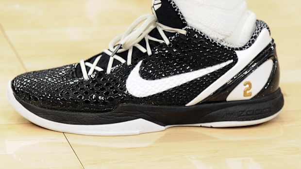 Black and white Nike Kobe shoes.